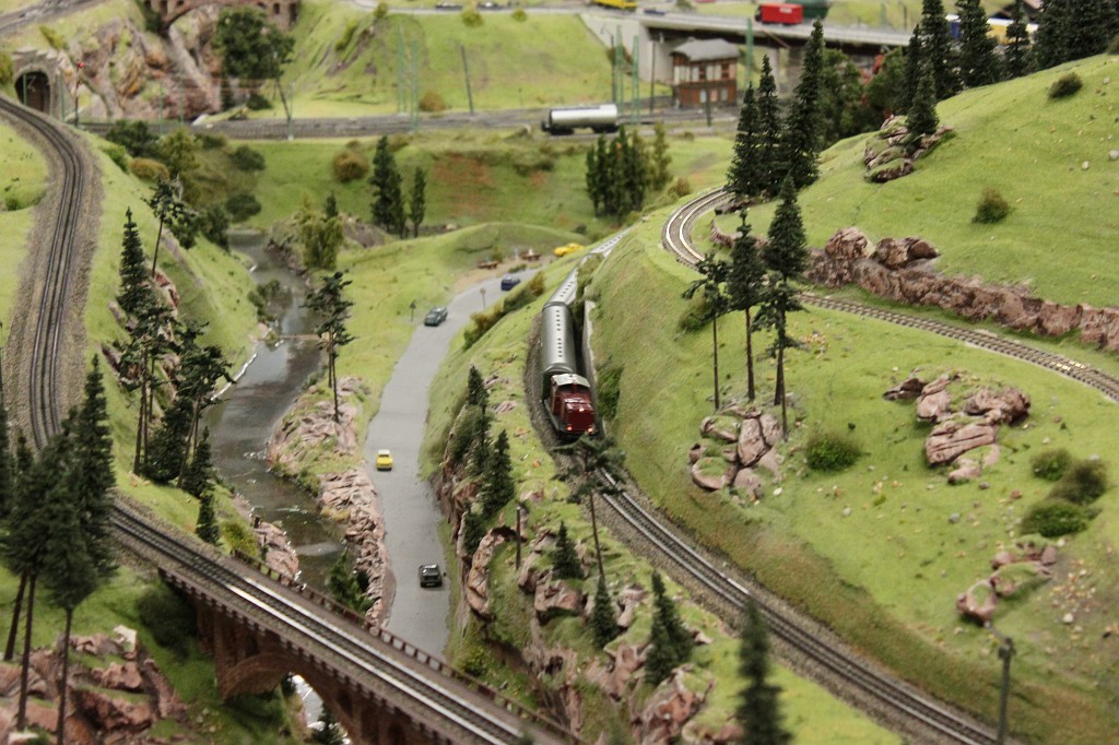 IMG_9432.JPG - Miniature Wonderland (Miniatur Wunderland)  http://en.wikipedia.org/wiki/Miniatur_Wunderland  Train running through valley.