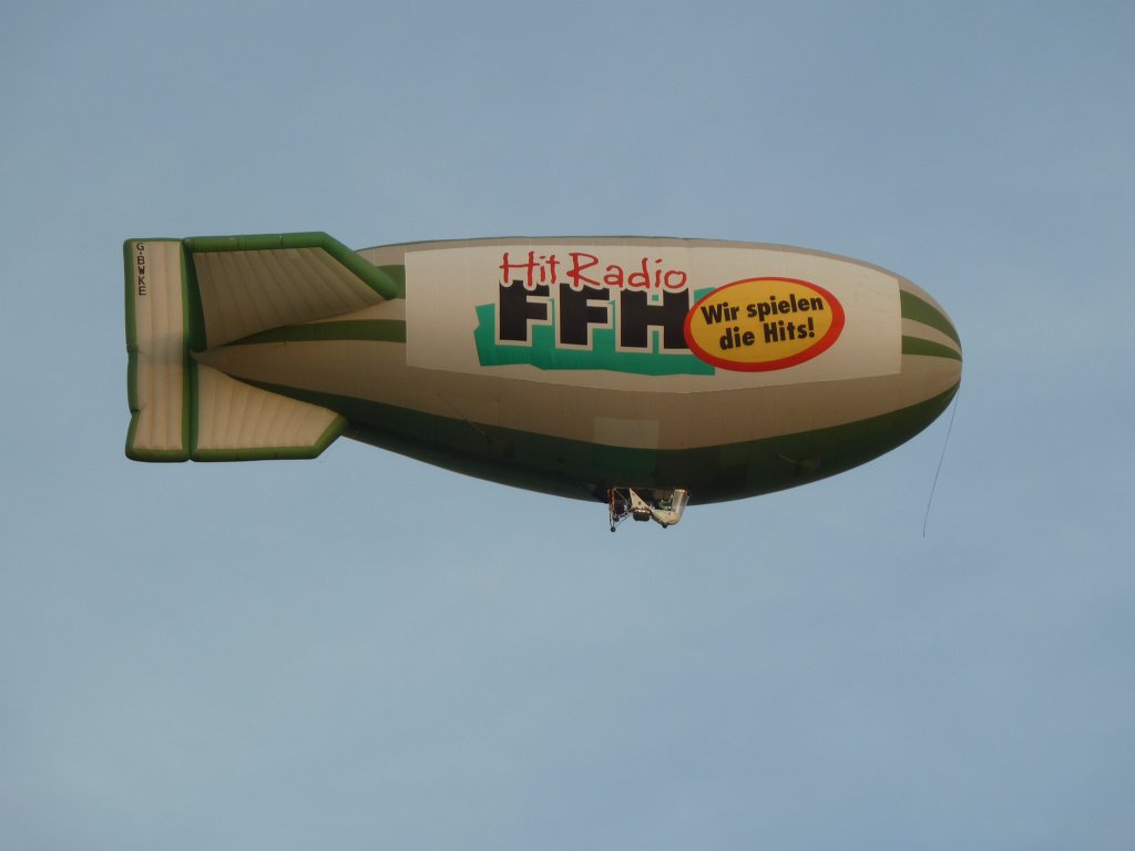 P1030280.JPG - Hit Radio FFH blimp  http://en.wikipedia.org/wiki/Blimp  taking a look at Roxette  http://en.wikipedia.org/wiki/Roxette  concert during the Hessentag  http://de.wikipedia.org/wiki/Hessentag  2011 in Oberursel  http://en.wikipedia.org/wiki/Oberursel_(Taunus) .