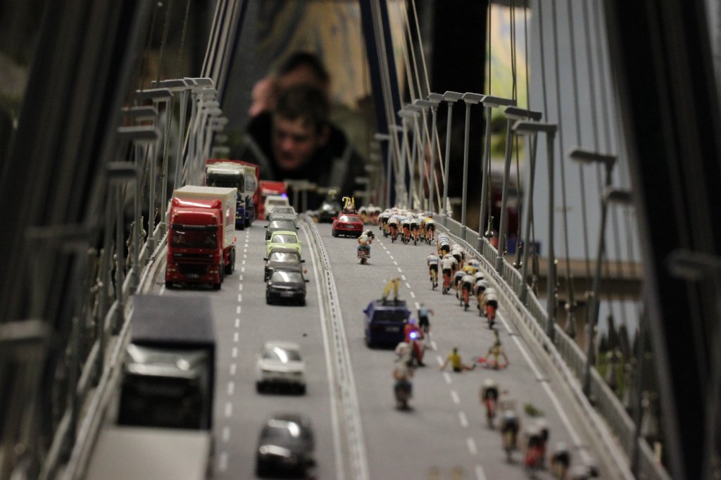 IMG_5728.JPG - Bicycle race on bridge in the  Miniatur Wunderland  ( miniature wonderland ). The world largest miniature railway not only host trains but also running cars, trucks, ship and even "flying" airplanes.