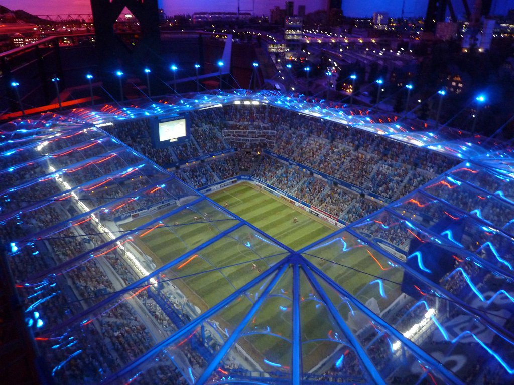 P1050470.JPG - Football match in the  Miniatur Wunderland  ( miniature wonderland ). The world largest miniature railway not only host trains but also running cars, trucks, ship and even "flying" airplanes.