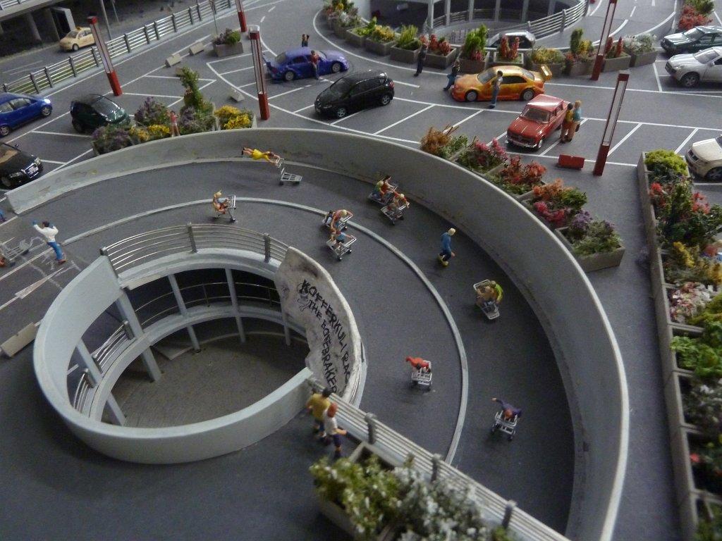 P1050490.JPG - Racing fun in the  Miniatur Wunderland  ( miniature wonderland ). The world largest miniature railway not only host trains but also running cars, trucks, ship and even "flying" airplanes.