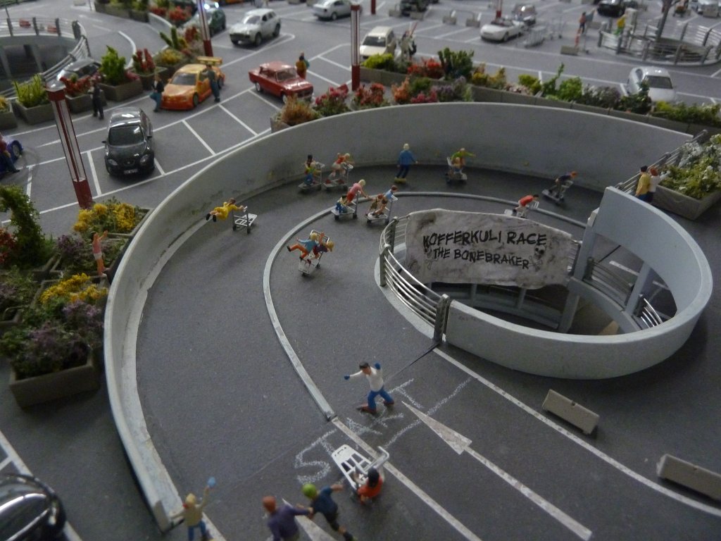 P1050492.JPG - Racing fun in the  Miniatur Wunderland  ( miniature wonderland ). The world largest miniature railway not only host trains but also running cars, trucks, ship and even "flying" airplanes.