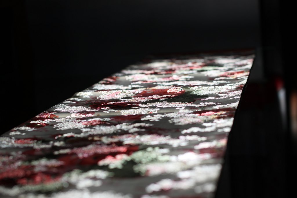 IMG_8618.JPG - Table runner in the sun. Only a small stripe of sun was coming in through the window and fell on a glass table covered by a small table runner.