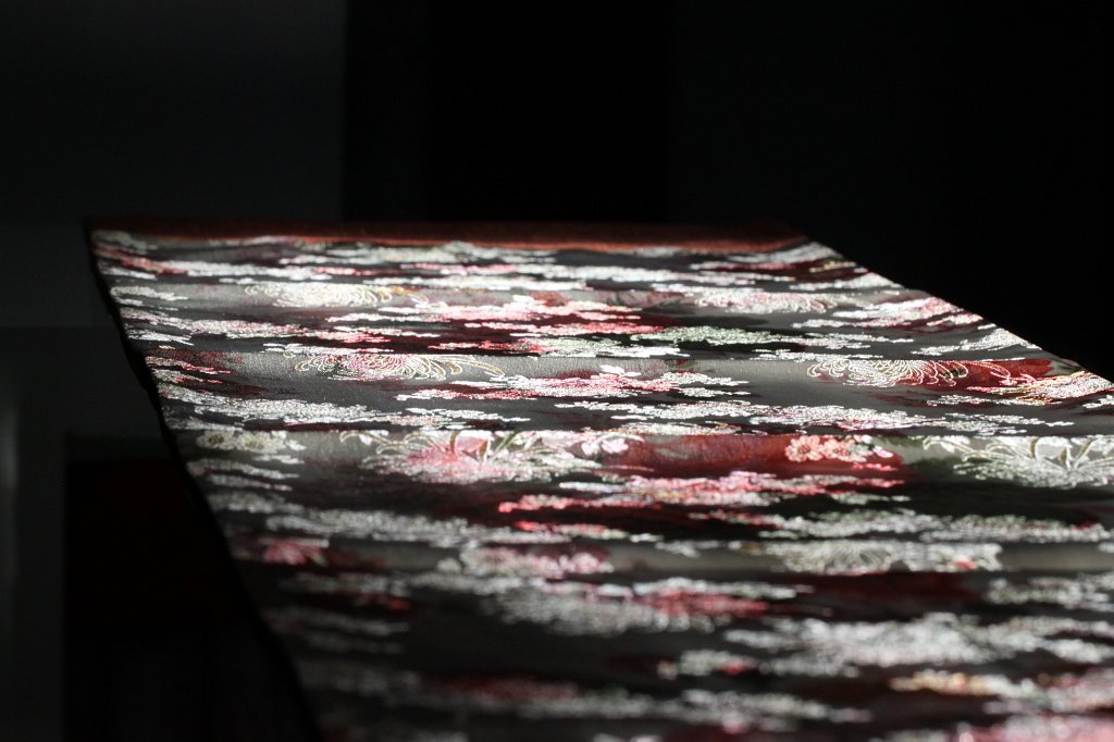 IMG_8621.JPG - Table runner in the sun. Only a small stripe of sun was coming in through the window and fell on a glass table covered by a small table runner.