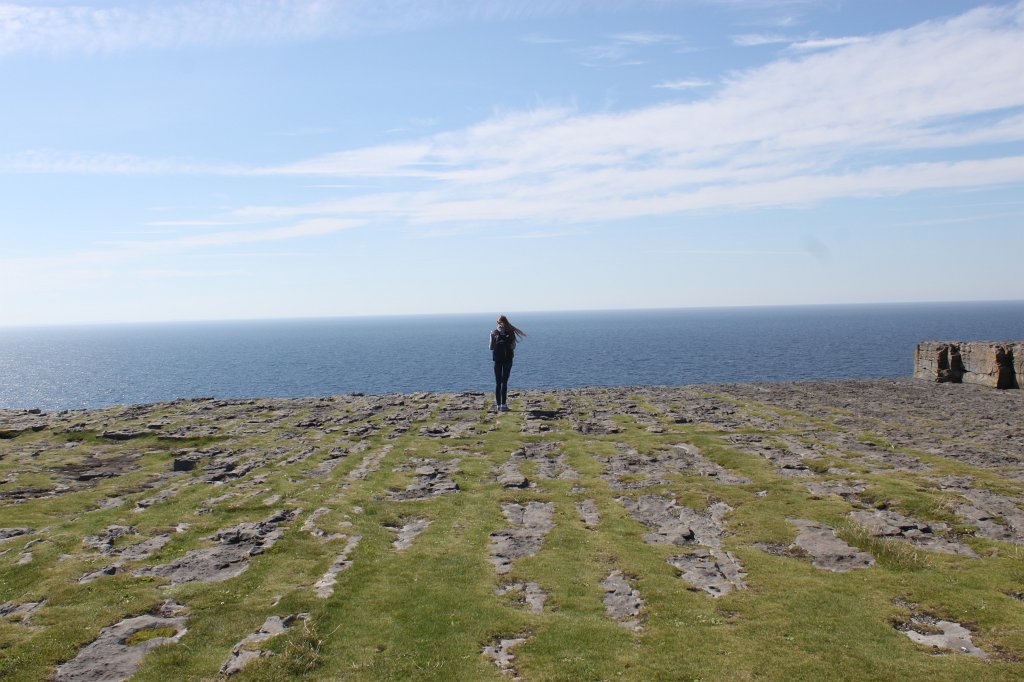 IMG_5107.JPG - Evelyn inside  Dún Aonghasa . Dún Aonghasa is a prehistoric fort on  Inishmore . Inishmore is the biggest of the  Aran islands .