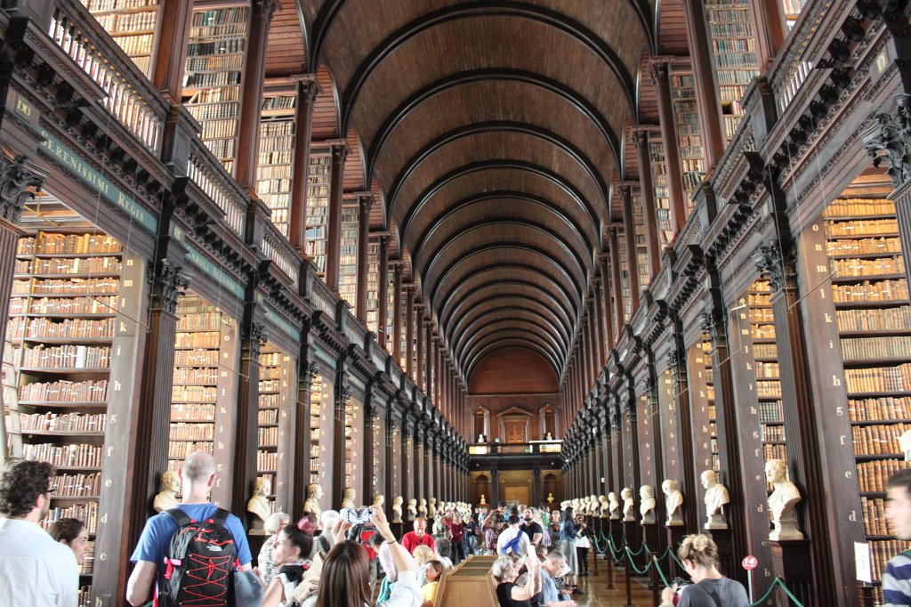 IMG_6510.JPG - The Long Room of the Old  Library  of  Trinity College  in Dublin. The library was founded together with the college in 1592. The library has legal deposit rights for Ireland and Great Britain. As such even the long room, even though extended in height, is far too small for all the books. The long room is the main chamber of the old library and was build between 1712 and 1732. It houses 200000 of the oldest books of the library.